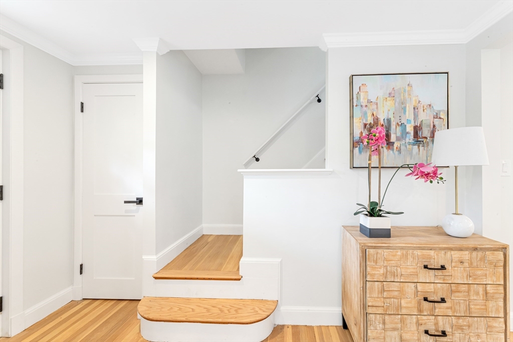 26 Crehore Road Boston, MA 02467 - Photo 4 of 33 a room with cabinet and mirror