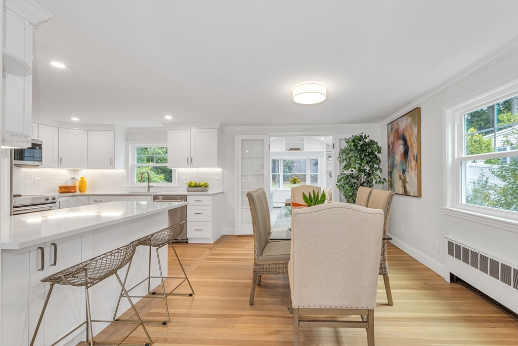 26 Crehore Road Boston, MA 02467 - Photo 7 of 33 a dining room with furniture and wooden floor