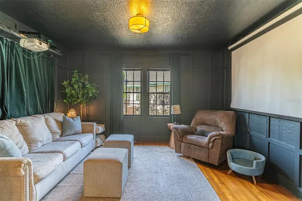 a living room with furniture and a window