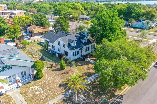 an aerial view of a house with yard swimming pool and outdoor seating
