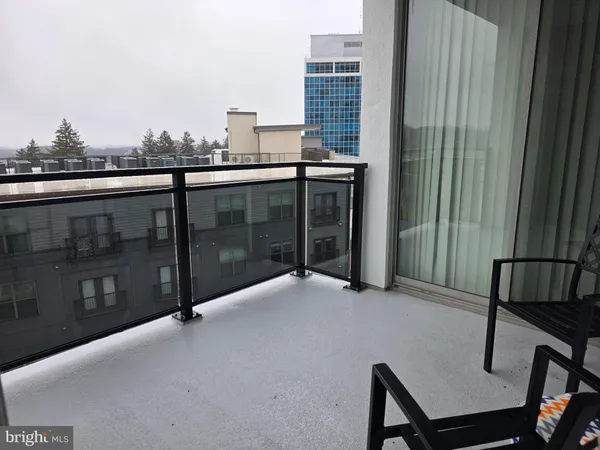 a balcony with a bench