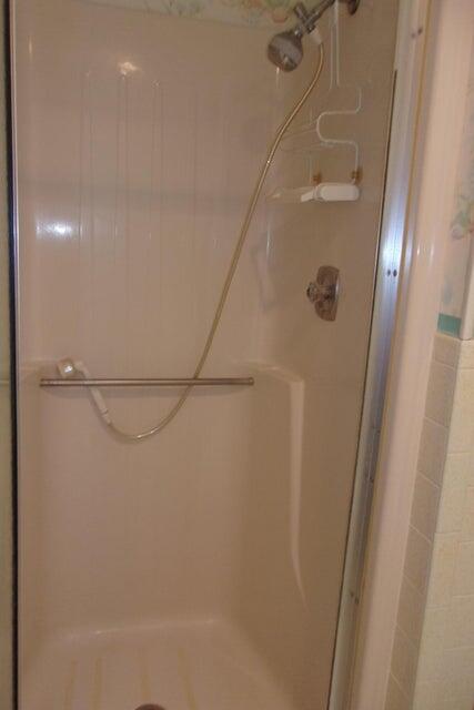 1225 Northwest 21st Street, Unit 3506 Stuart, FL 34994 - Photo 11 of 25 a bathroom with a shower