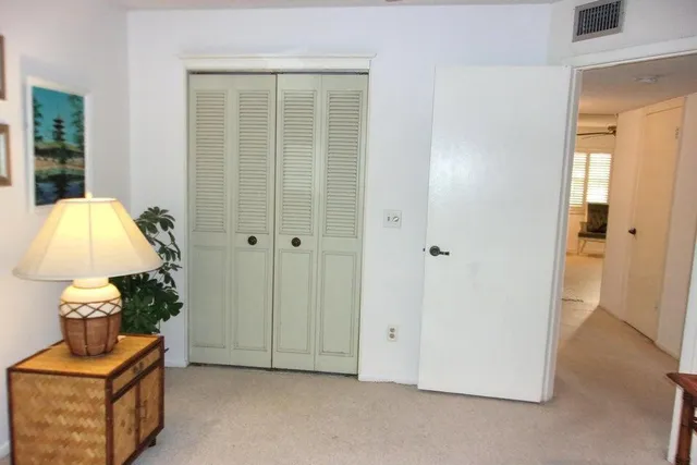 a bedroom with a bed and a table