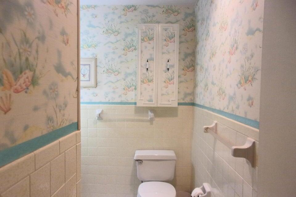 1225 Northwest 21st Street, Unit 3506 Stuart, FL 34994 - Photo 10 of 25 a bathroom with a toilet and a shower