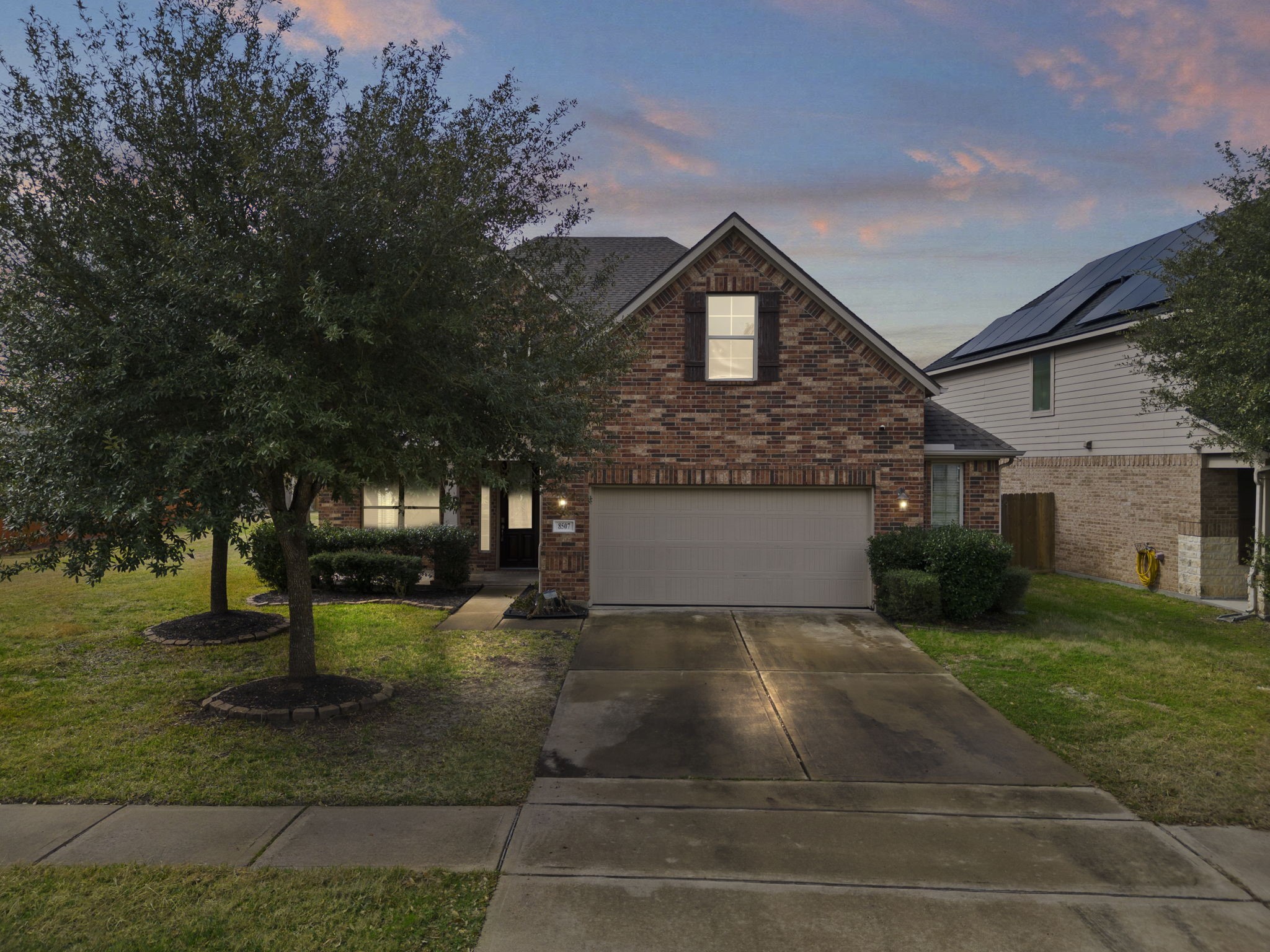 a view of a house with yard and tree s