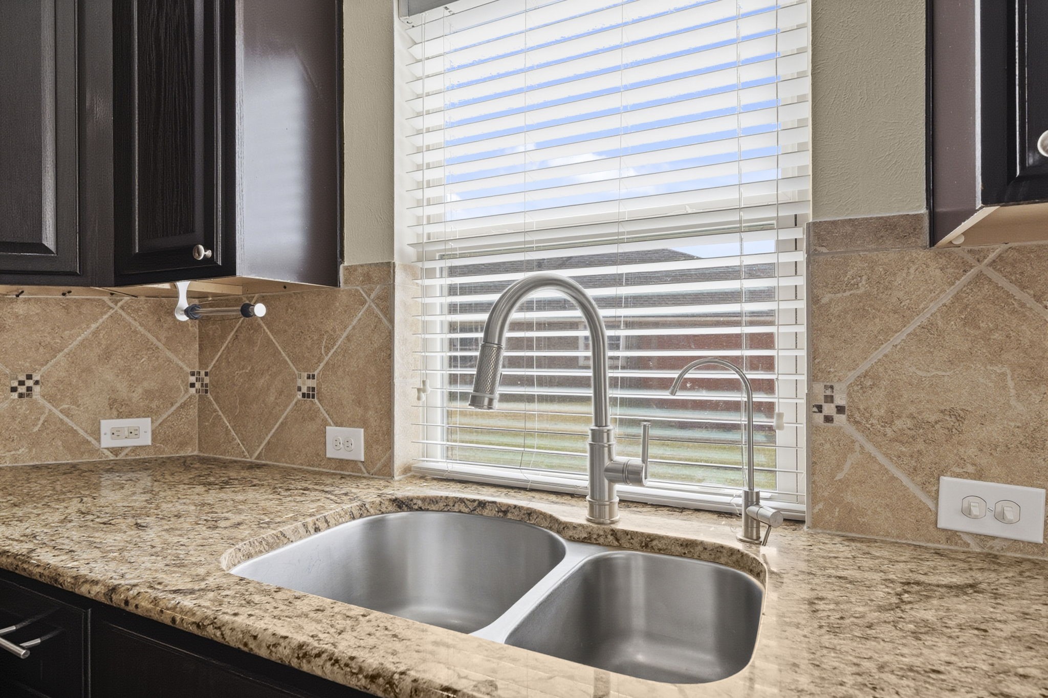 8507 Clarkman Ridge Lane Cypress, TX 77433 - Photo 14 of 48 a view of a kitchen sink next to a window