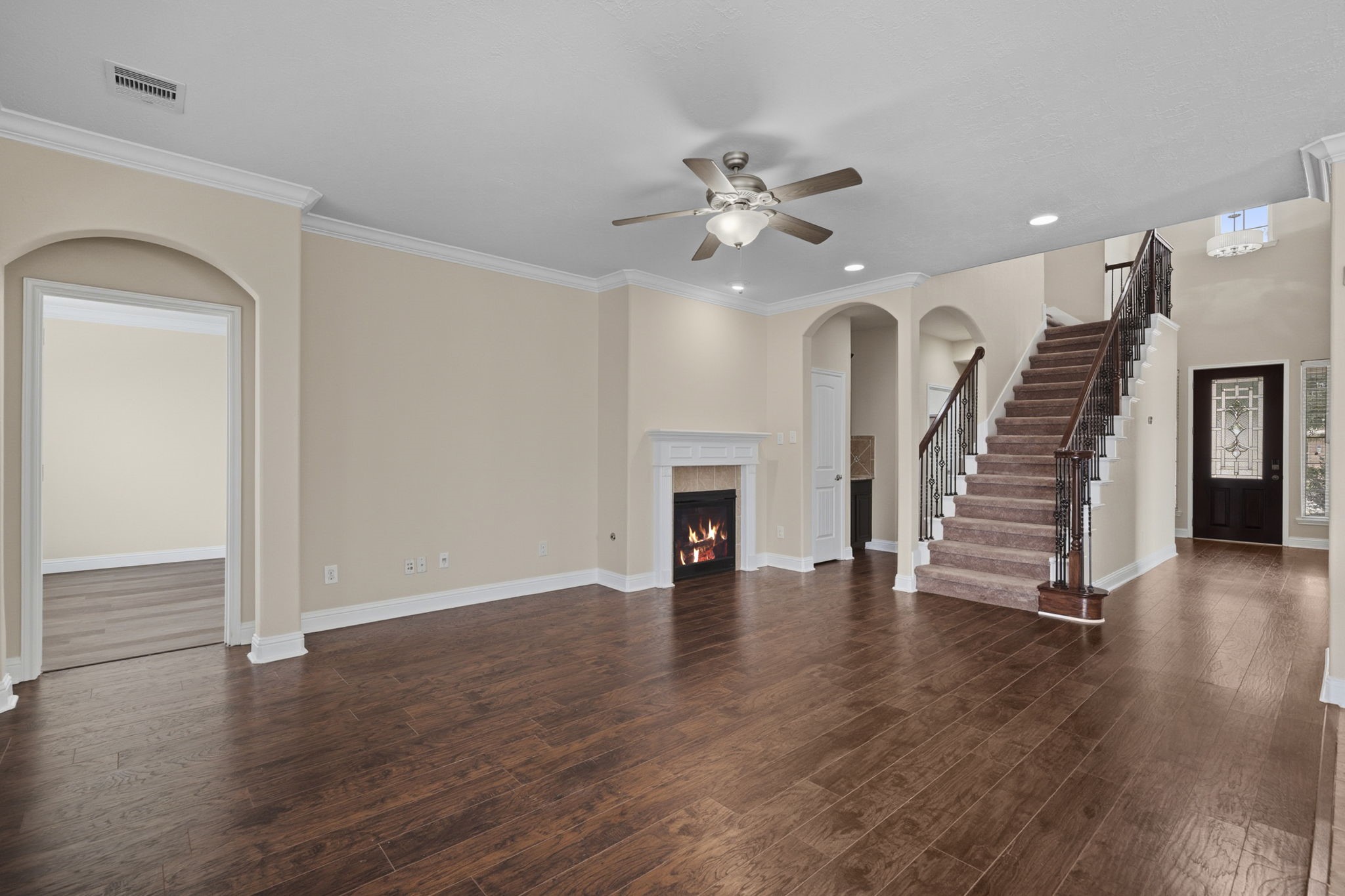 8507 Clarkman Ridge Lane Cypress, TX 77433 - Photo 18 of 48 wooden floor in an empty room with a fireplace