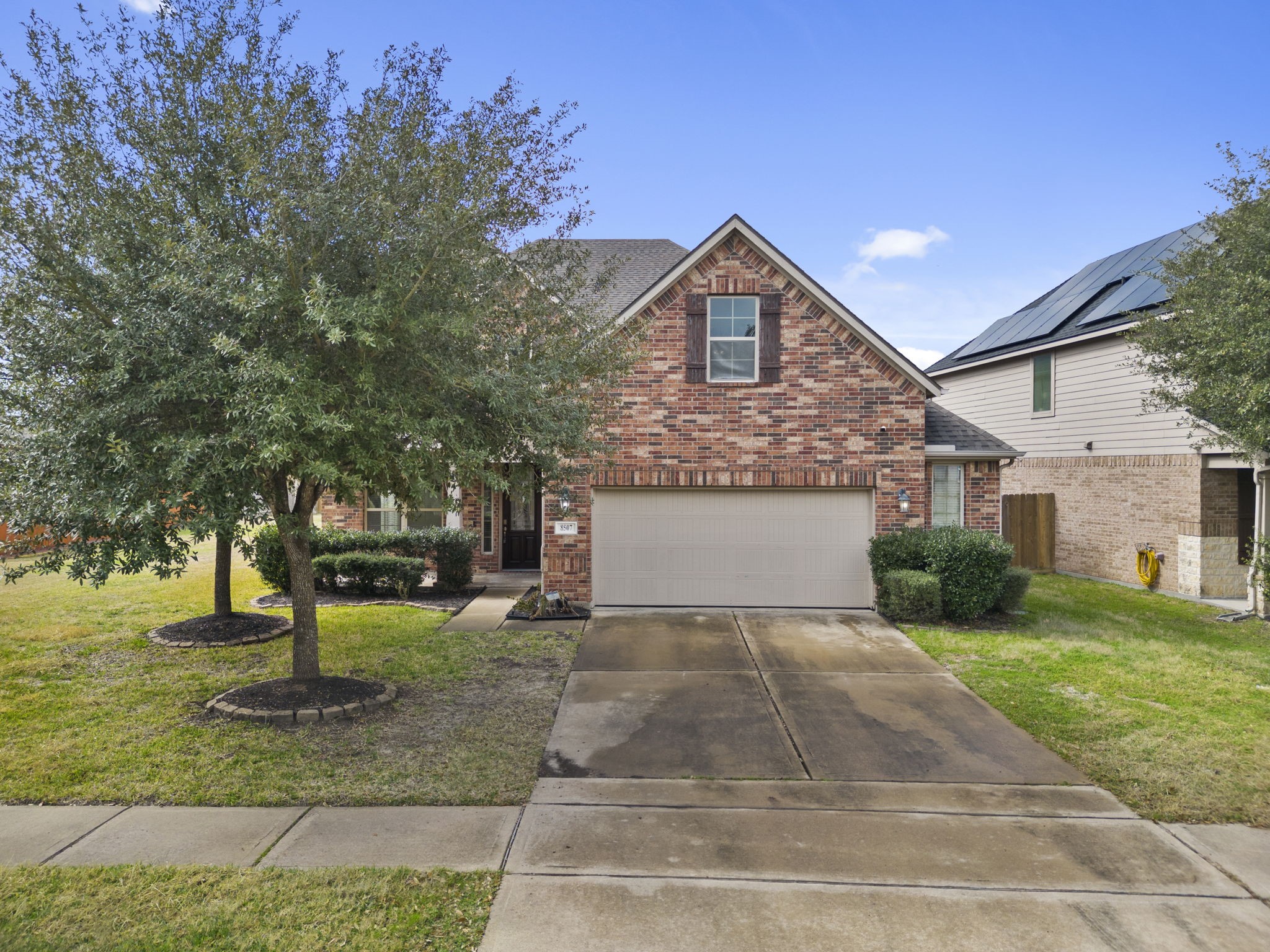 8507 Clarkman Ridge Lane Cypress, TX 77433 - Photo 2 of 48 a front view of a house with a yard and tree