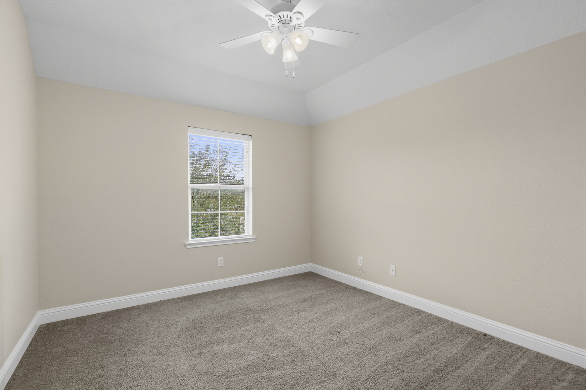 8507 Clarkman Ridge Lane Cypress, TX 77433 - Photo 35 of 48 an empty room with a window and a fan
