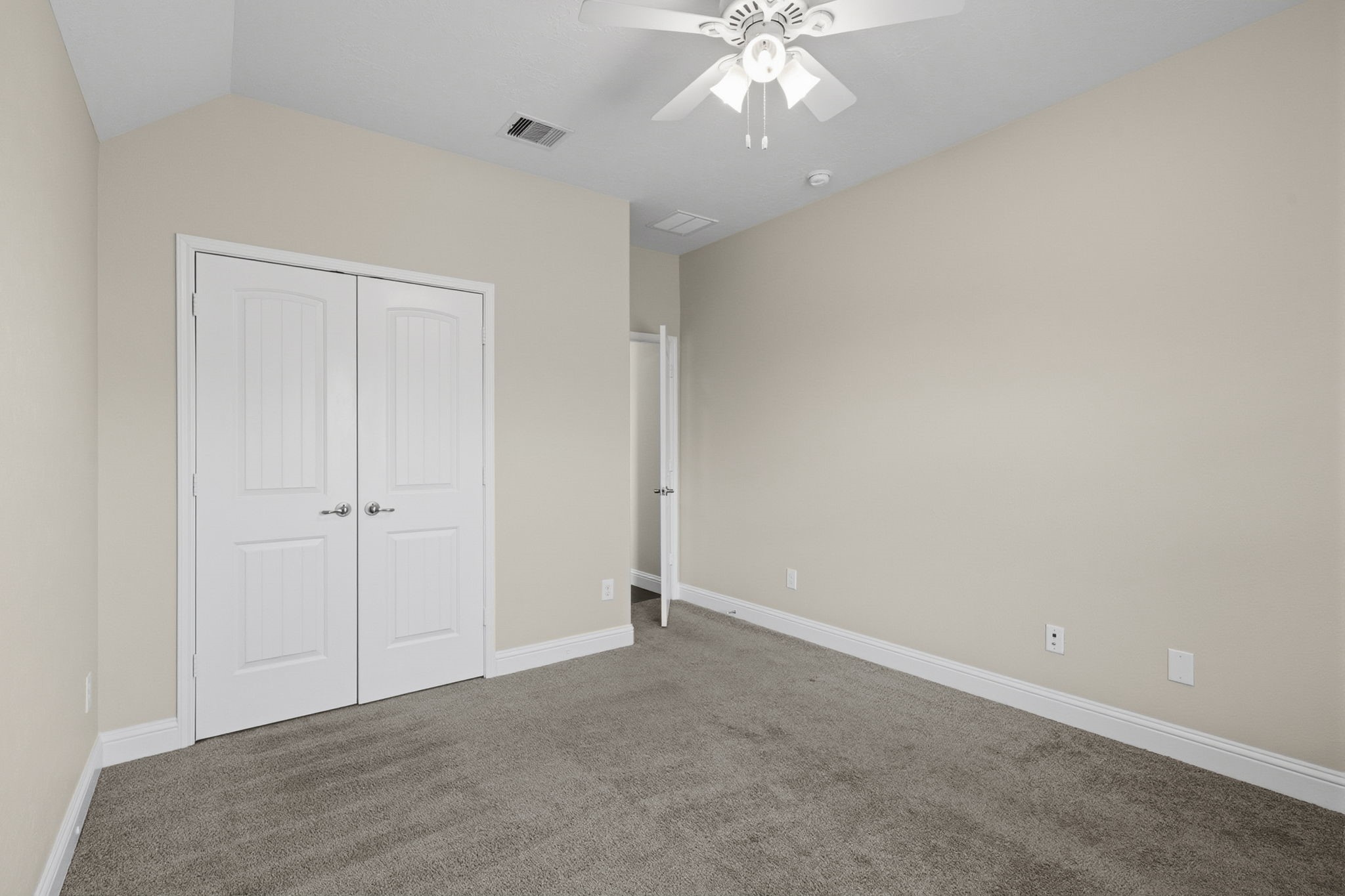 8507 Clarkman Ridge Lane Cypress, TX 77433 - Photo 36 of 48 a view of an empty room with a chandelier fan