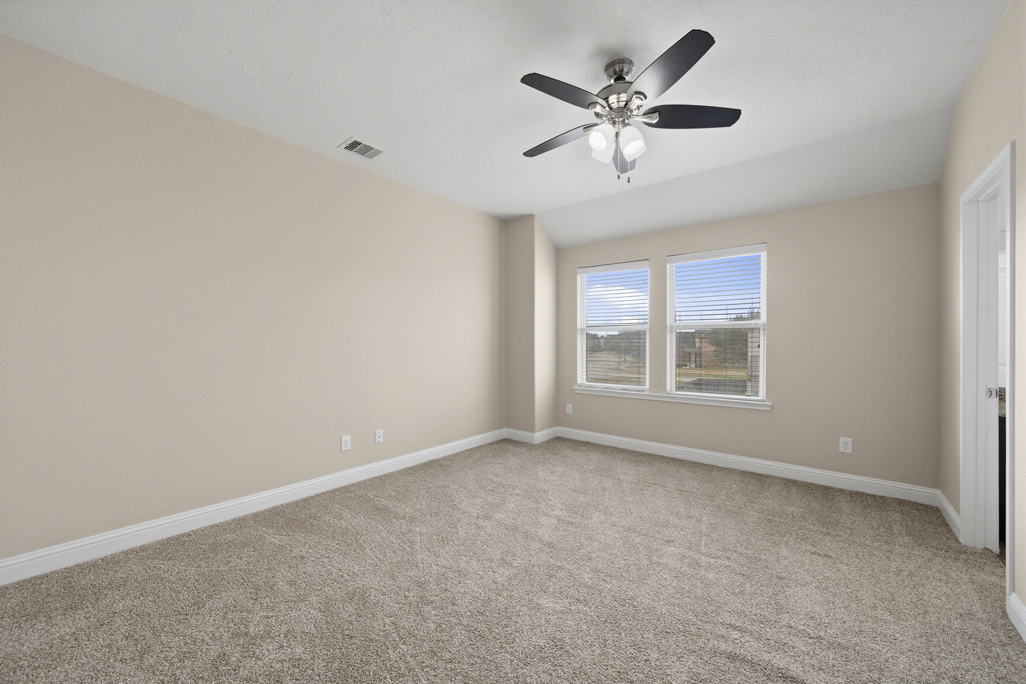 8507 Clarkman Ridge Lane Cypress, TX 77433 - Photo 40 of 48 an empty room with ceiling fan and windows