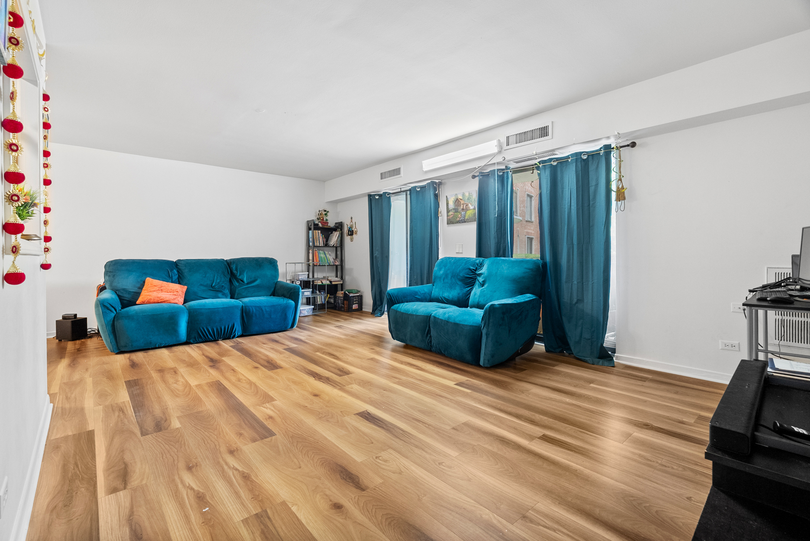 1405 East Central Road, Unit 110B Arlington Heights, IL 60005 - Photo 11 of 24 a bedroom with a bed window and dresser
