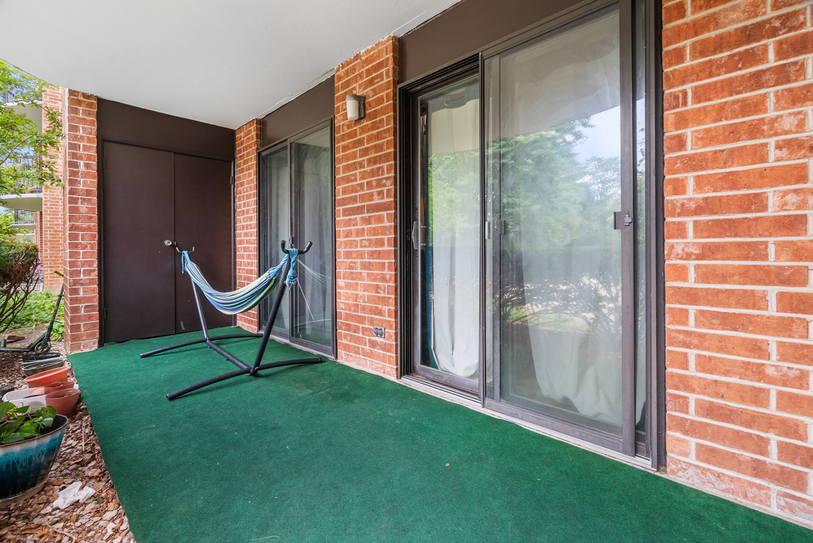 1405 East Central Road, Unit 110B Arlington Heights, IL 60005 - Photo 18 of 24 a view of a outdoor space with a door and windows