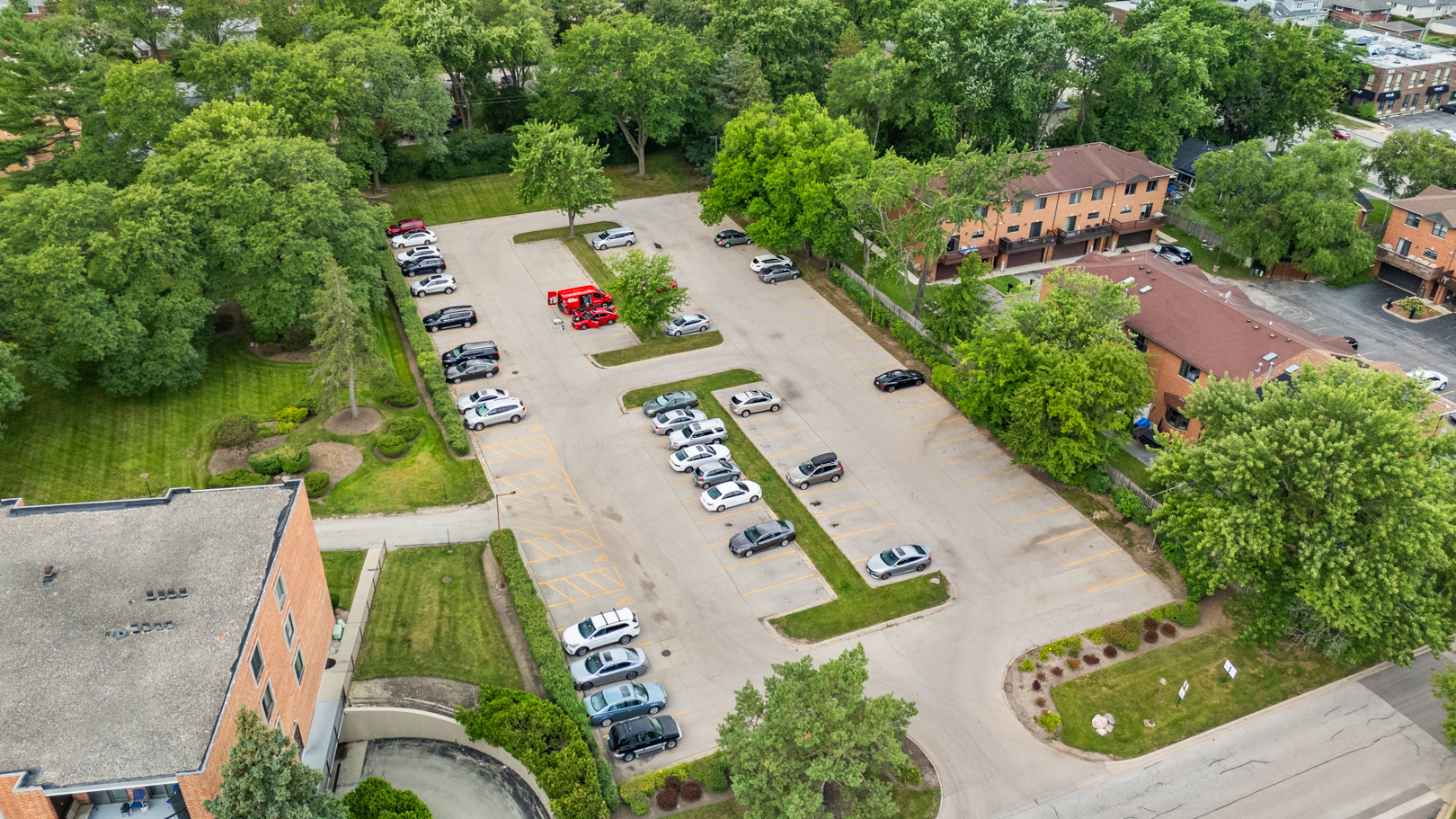 1405 East Central Road, Unit 110B Arlington Heights, IL 60005 - Photo 21 of 24 an aerial view of a house with outdoor space