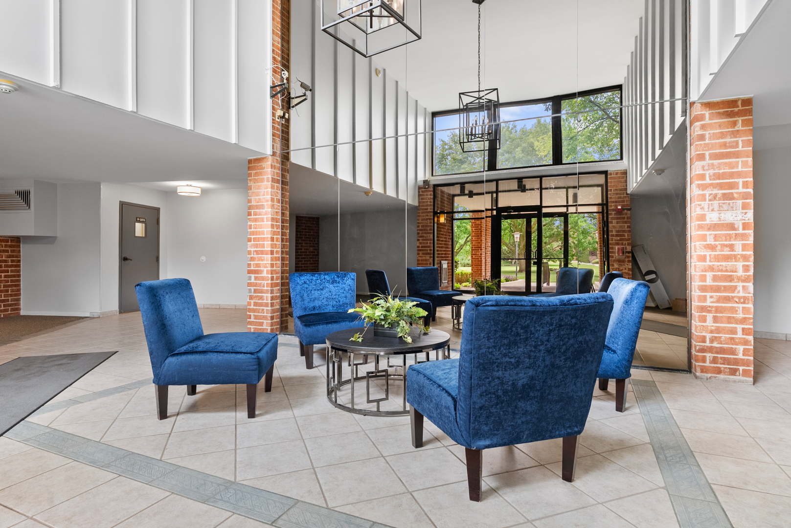 1405 East Central Road, Unit 110B Arlington Heights, IL 60005 - Photo 3 of 24 a living room with furniture and a large window