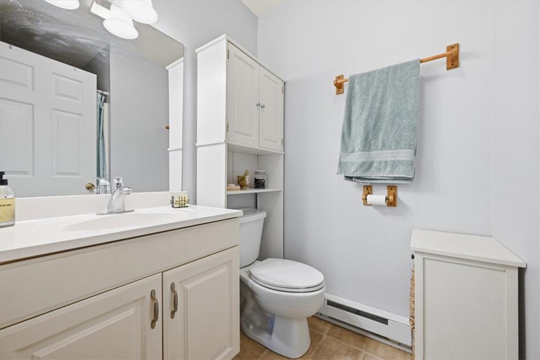 128 Chestnut Street Dingmans Ferry, PA 18328 - Photo 19 of 43 Functional and crisp, this bathroom offers a clean vanity and essential fixtures.