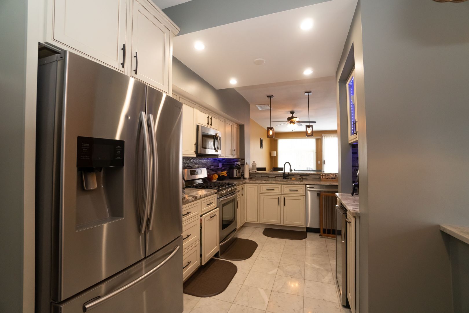 8233 Ripple Ridge, Unit 8233 Darien, IL 60561 - Photo 4 of 18 a kitchen with refrigerator and microwave
