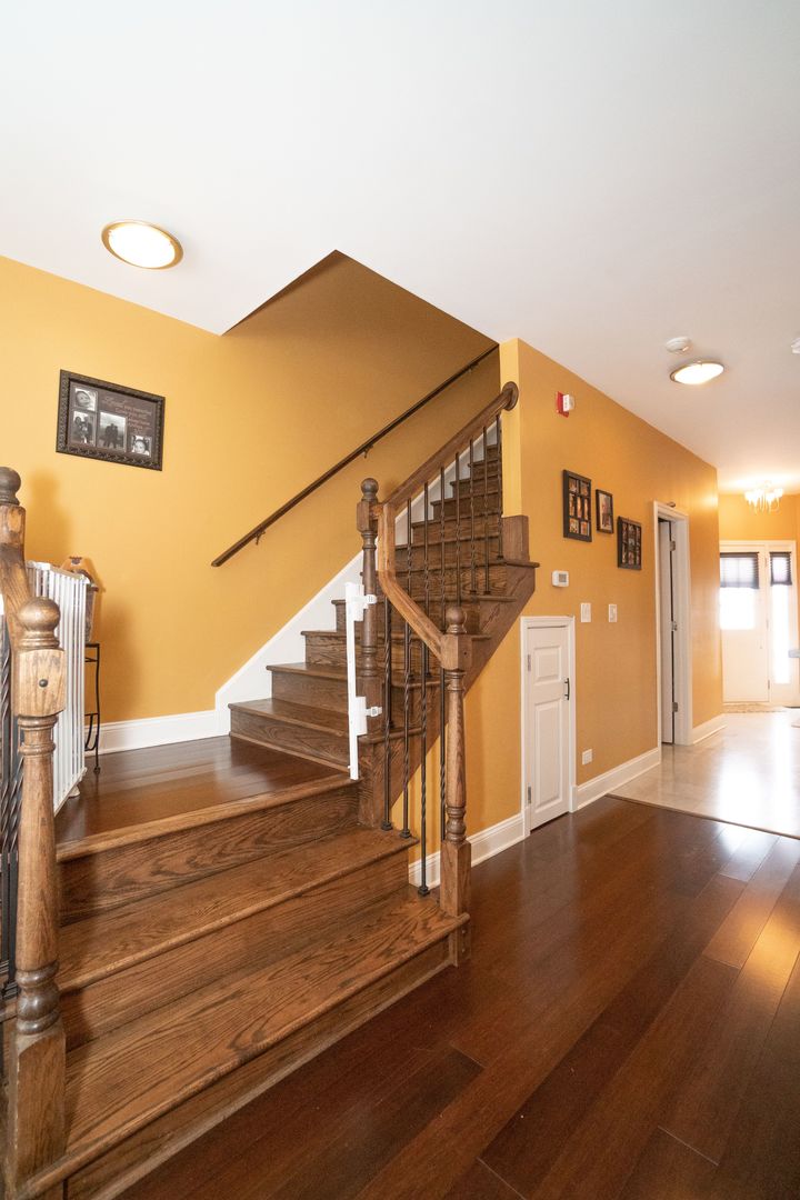 8233 Ripple Ridge, Unit 8233 Darien, IL 60561 - Photo 6 of 18 a view of entryway and hall with wooden floor