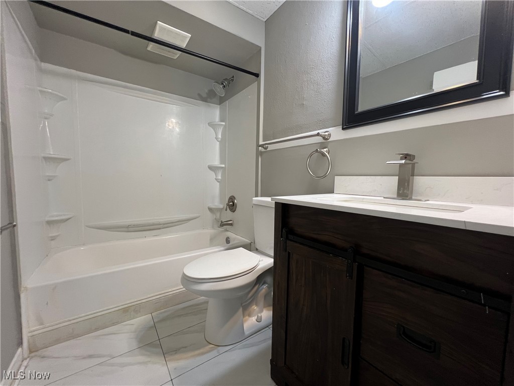 3371 Berea Road Cleveland, OH 44111 - Photo 17 of 27 Full bathroom featuring shower / tub combination, toilet, and vanity