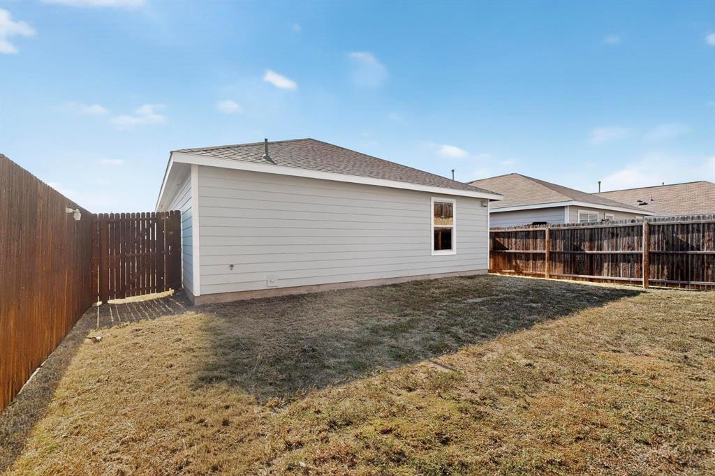 5516 McClelland Street Forney, TX 75126 - Photo 28 of 36 Rear view of house with a fenced backyard