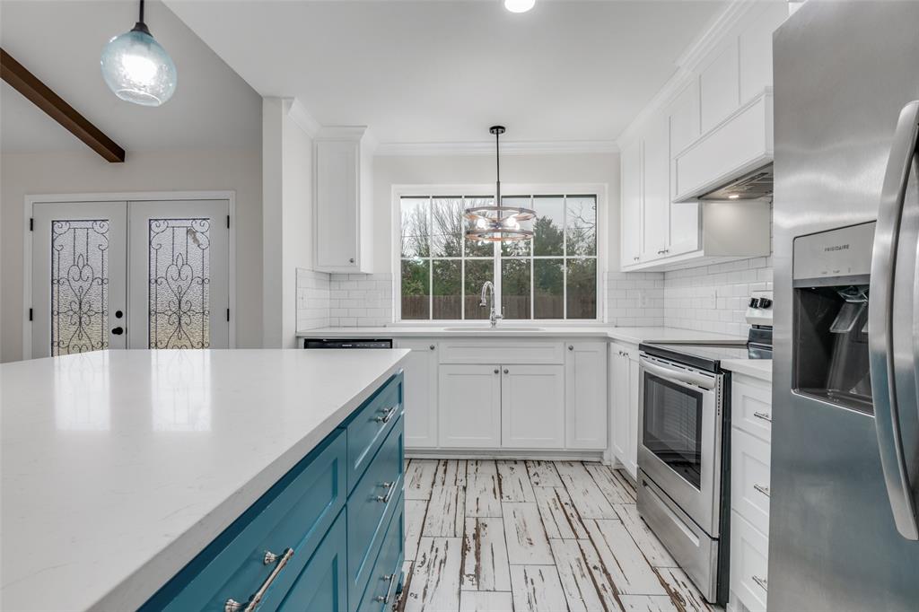 1055 Wright Street Terrell, TX 75160 - Photo 10 of 20 a kitchen with stainless steel appliances granite countertop a stove and a sink