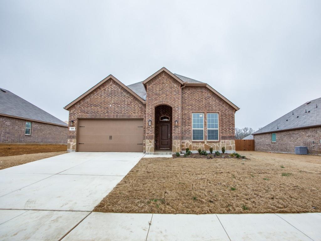 123 Lakeview Circle Pilot Point, TX 76258 - Photo 4 of 39 a front view of a house with a yard