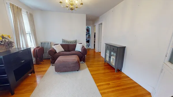 a living room with furniture and a rug