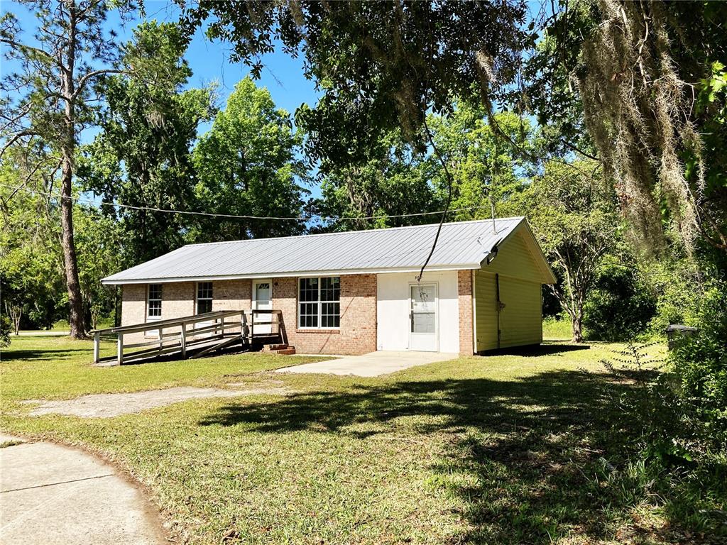 580 Southeast 5th Avenue Lake Butler, FL 32054 - Photo 1 of 6 a view of a house with a big yard