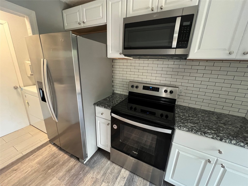 5808 Wellington Drive, Unit 4 Austin, TX 78723 - Photo 4 of 12 a kitchen with a stove microwave and refrigerator