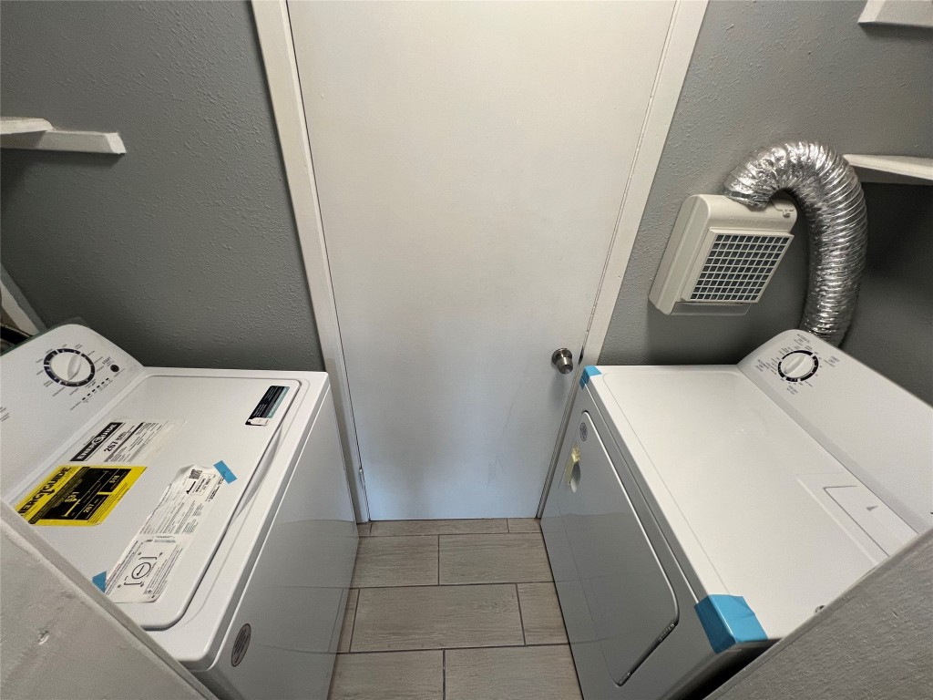 5808 Wellington Drive, Unit 4 Austin, TX 78723 - Photo 6 of 12 a utility room with dryer and washer