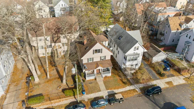 an aerial view of a residential apartment building with a yard