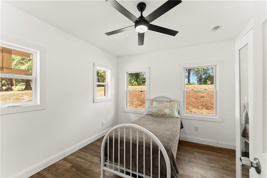 455 Cliff Nelson Road Taylorsville, GA 30178 - Photo 11 of 42 a view of a bedroom with wooden floor and windows