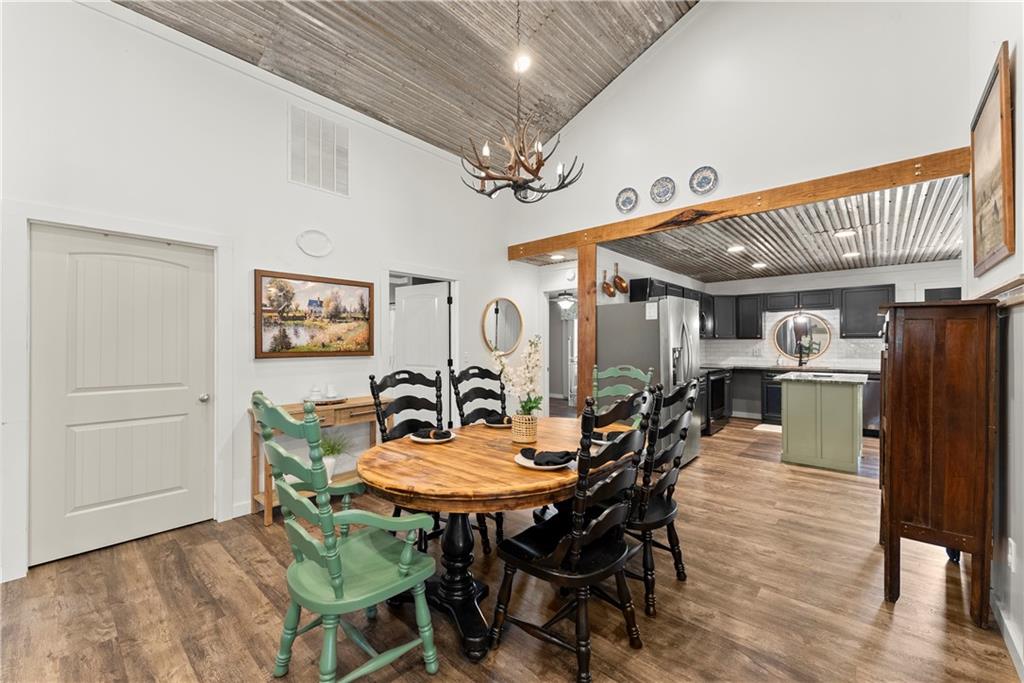 455 Cliff Nelson Road Taylorsville, GA 30178 - Photo 12 of 42 a dining room with furniture and window