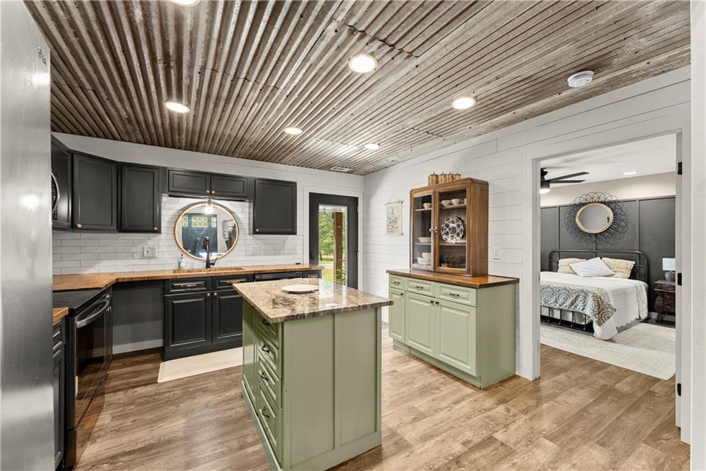 455 Cliff Nelson Road Taylorsville, GA 30178 - Photo 15 of 42 a kitchen with stainless steel appliances granite countertop lots of counter top space