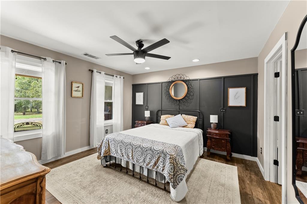 455 Cliff Nelson Road Taylorsville, GA 30178 - Photo 17 of 42 a bedroom with a bed and a table in it with window