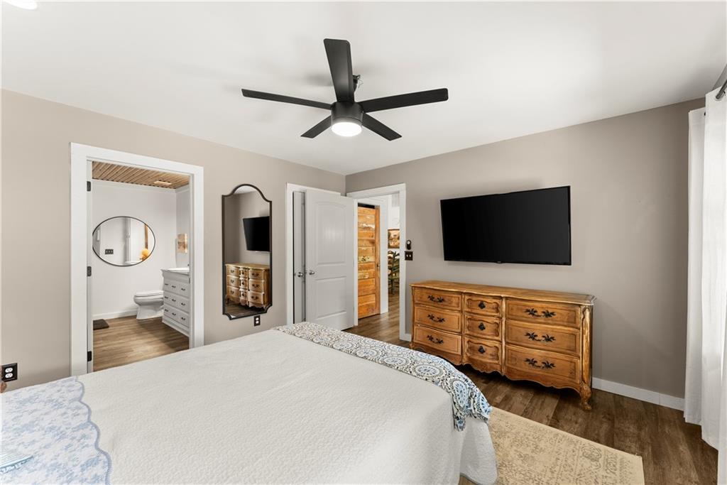 455 Cliff Nelson Road Taylorsville, GA 30178 - Photo 18 of 42 a bedroom with a bed and a flat screen tv