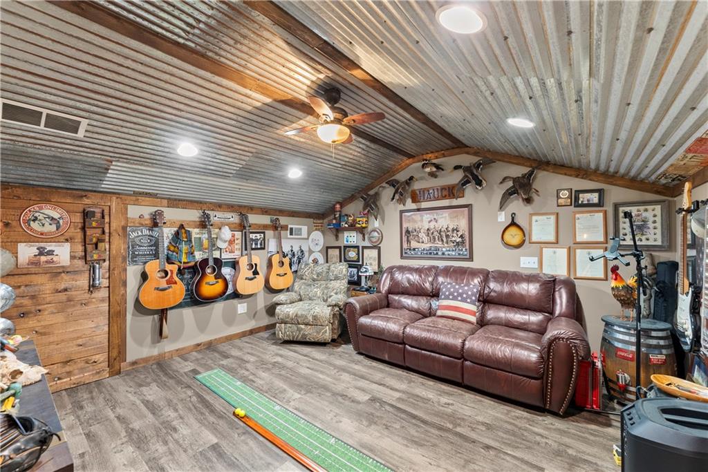 455 Cliff Nelson Road Taylorsville, GA 30178 - Photo 28 of 42 a living room with furniture and a flat screen tv