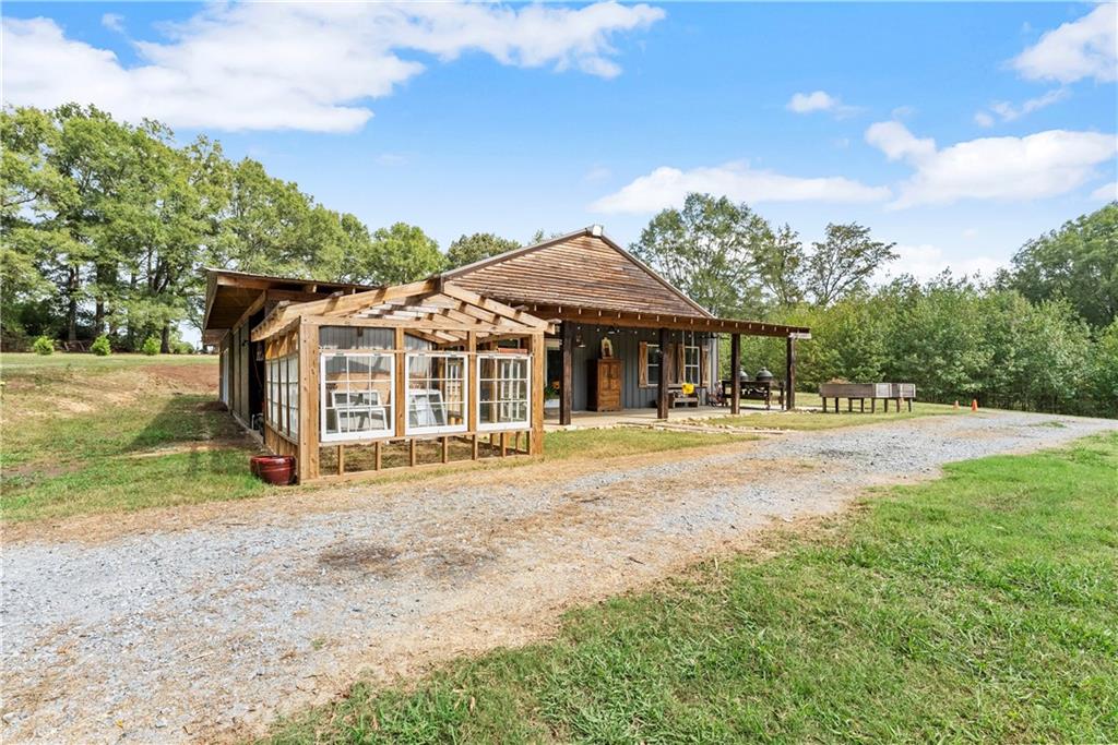 455 Cliff Nelson Road Taylorsville, GA 30178 - Photo 33 of 42 a front view of a house with a yard