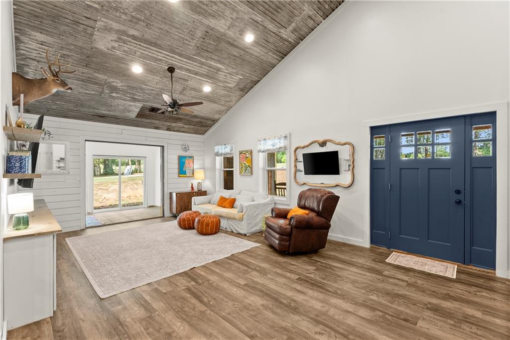 455 Cliff Nelson Road Taylorsville, GA 30178 - Photo 7 of 42 a living room with furniture a flat screen tv and a fireplace