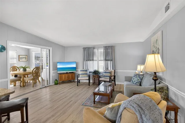 a living room with furniture or couch and a potted plant