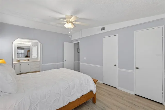 a hallway with cabinets and window