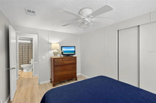 an aerial view of a house with a yard and lake view