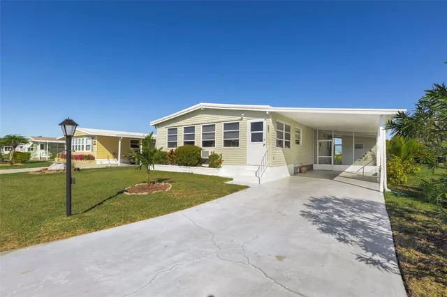 a swimming pool view with a seating space and a garden