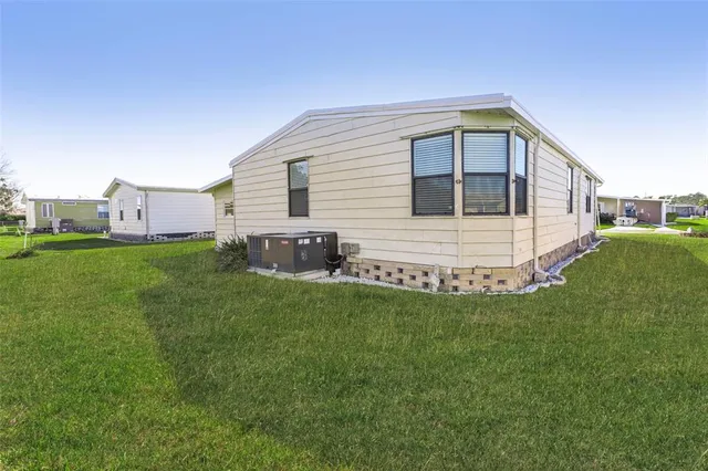 a living room with lots of furniture and a large window