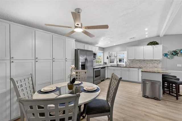 a dining room with furniture and window