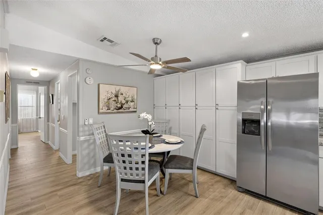 a kitchen with granite countertop stainless steel appliances and wooden cabinets