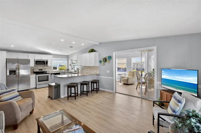 a living room with furniture and a lamp