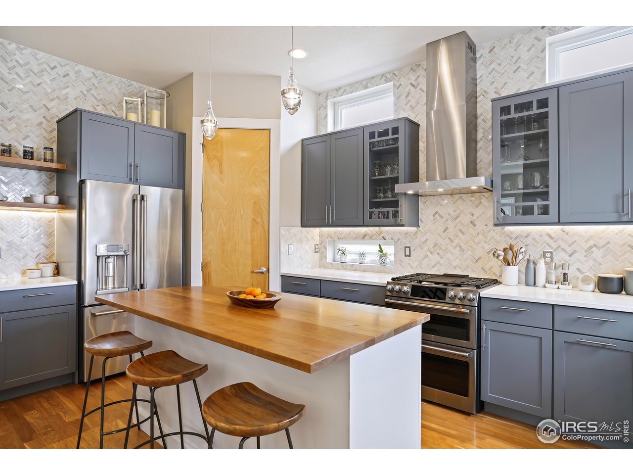 5263 Denver Street Boulder, CO 80304 - Photo 11 of 40 a kitchen with stainless steel appliances granite countertop a sink stove and refrigerator