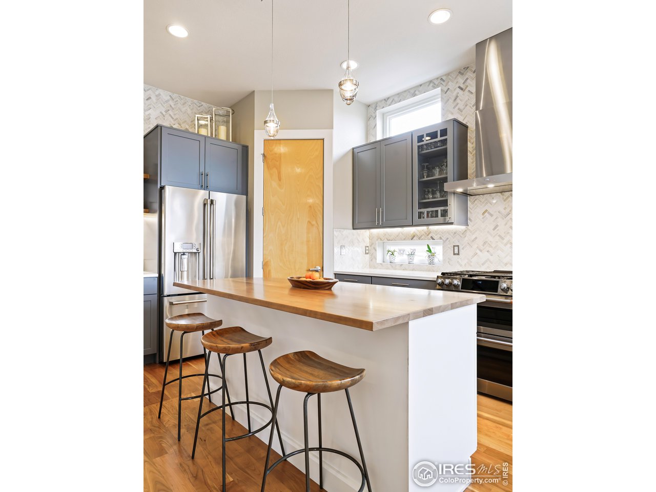 5263 Denver Street Boulder, CO 80304 - Photo 12 of 40 a large kitchen with a sink stainless steel appliances and furniture