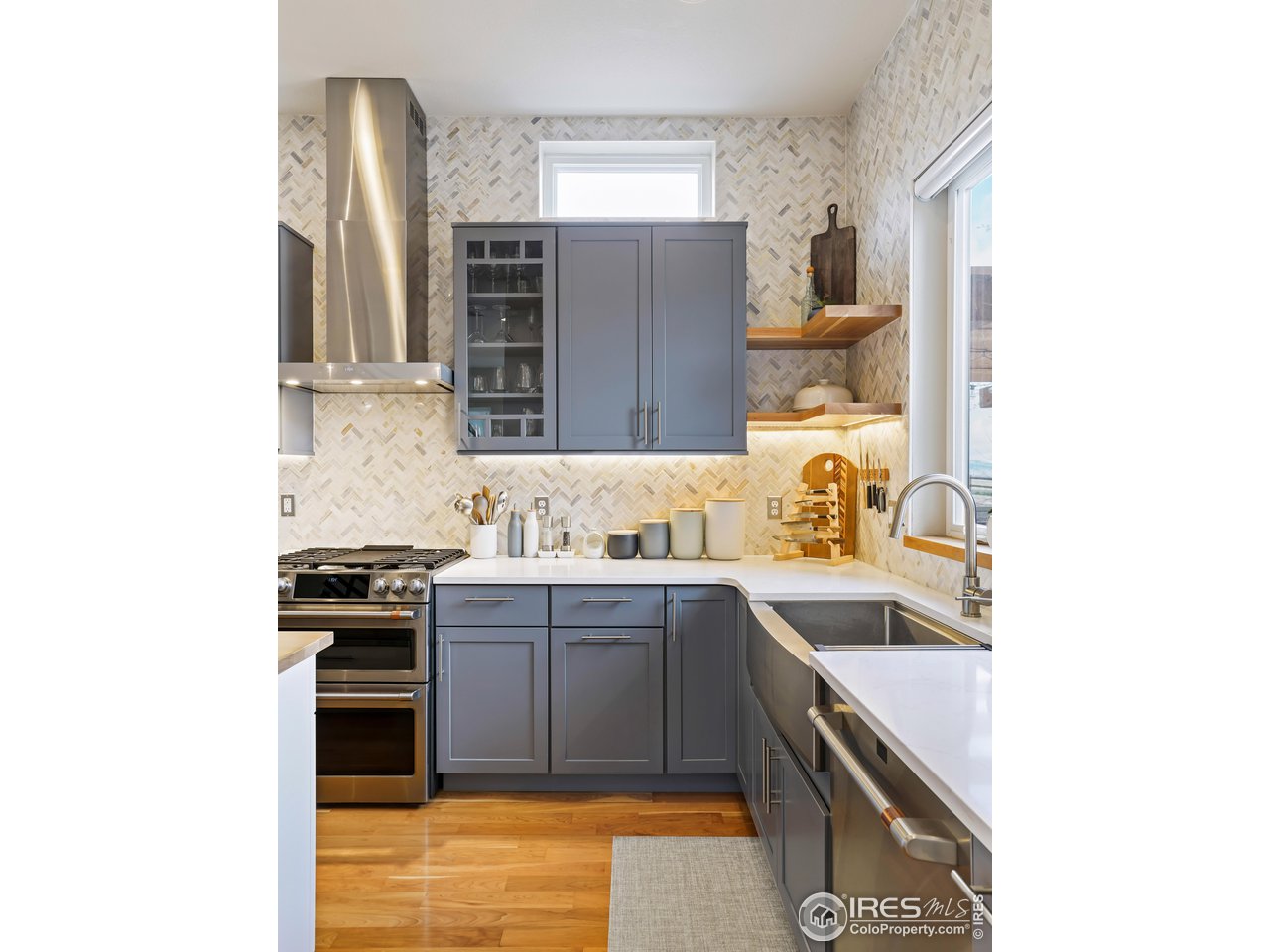 5263 Denver Street Boulder, CO 80304 - Photo 13 of 40 a kitchen with stainless steel appliances granite countertop a sink and stove top oven
